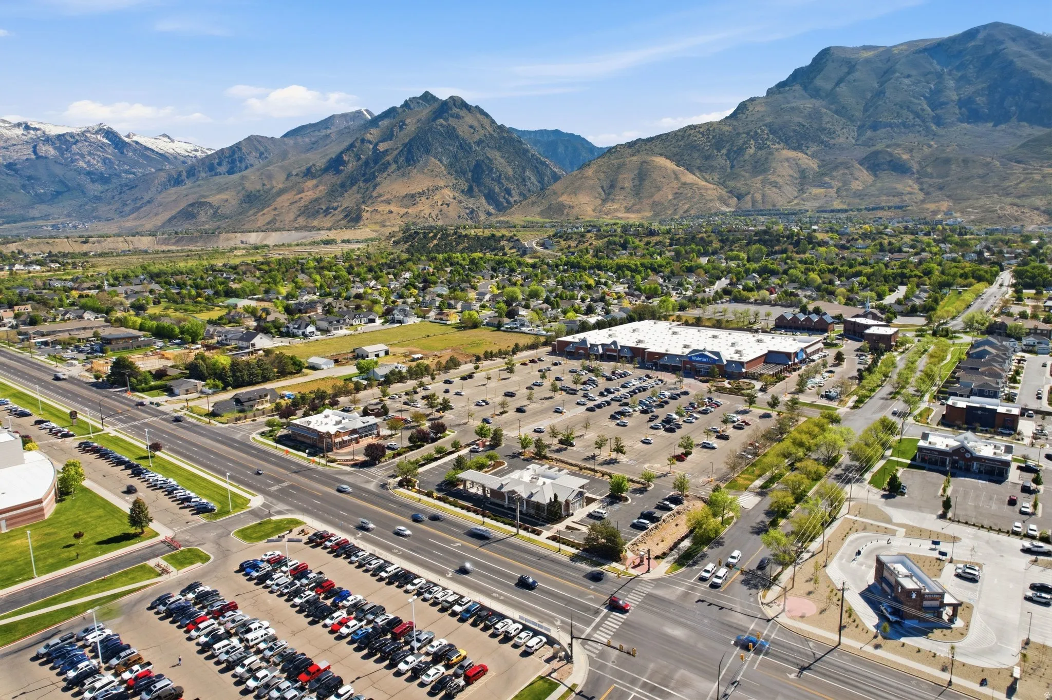 Expansive commercial property featuring a large retail building with extensive surface parking