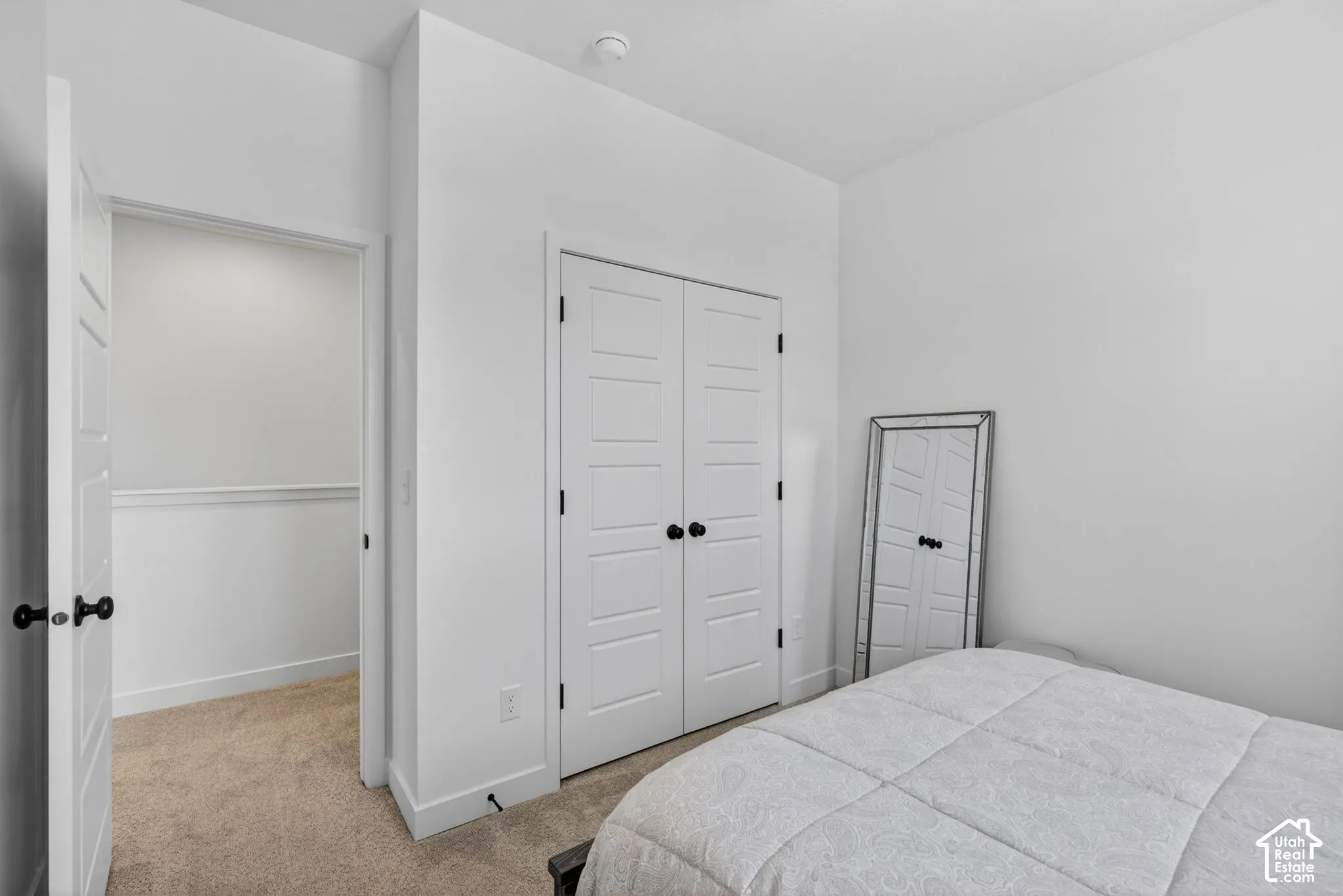Neutral tone walls with coordinating carpeting