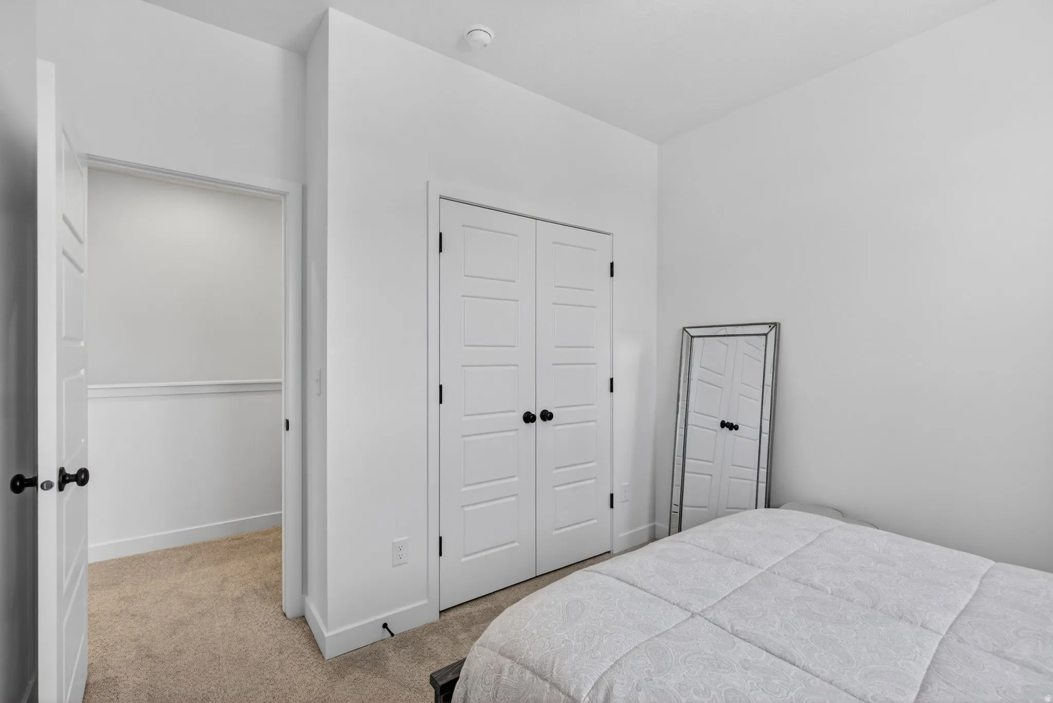 Neutral tone walls with coordinating carpeting