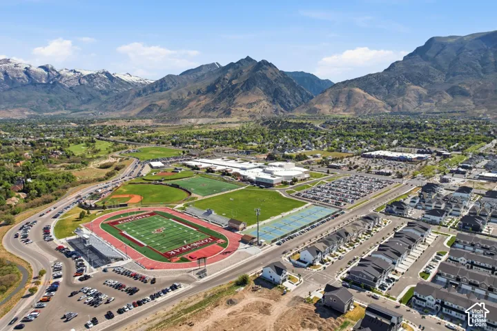 Aerial perspective showcasing a residential development with mountain backdrops