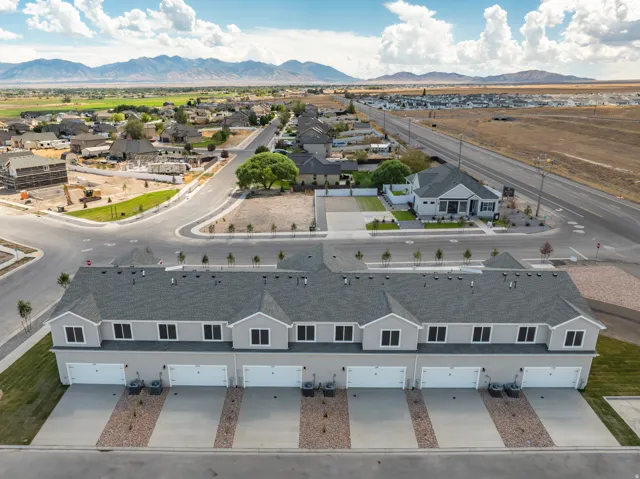 Townhome development featuring a row of units with attached garages