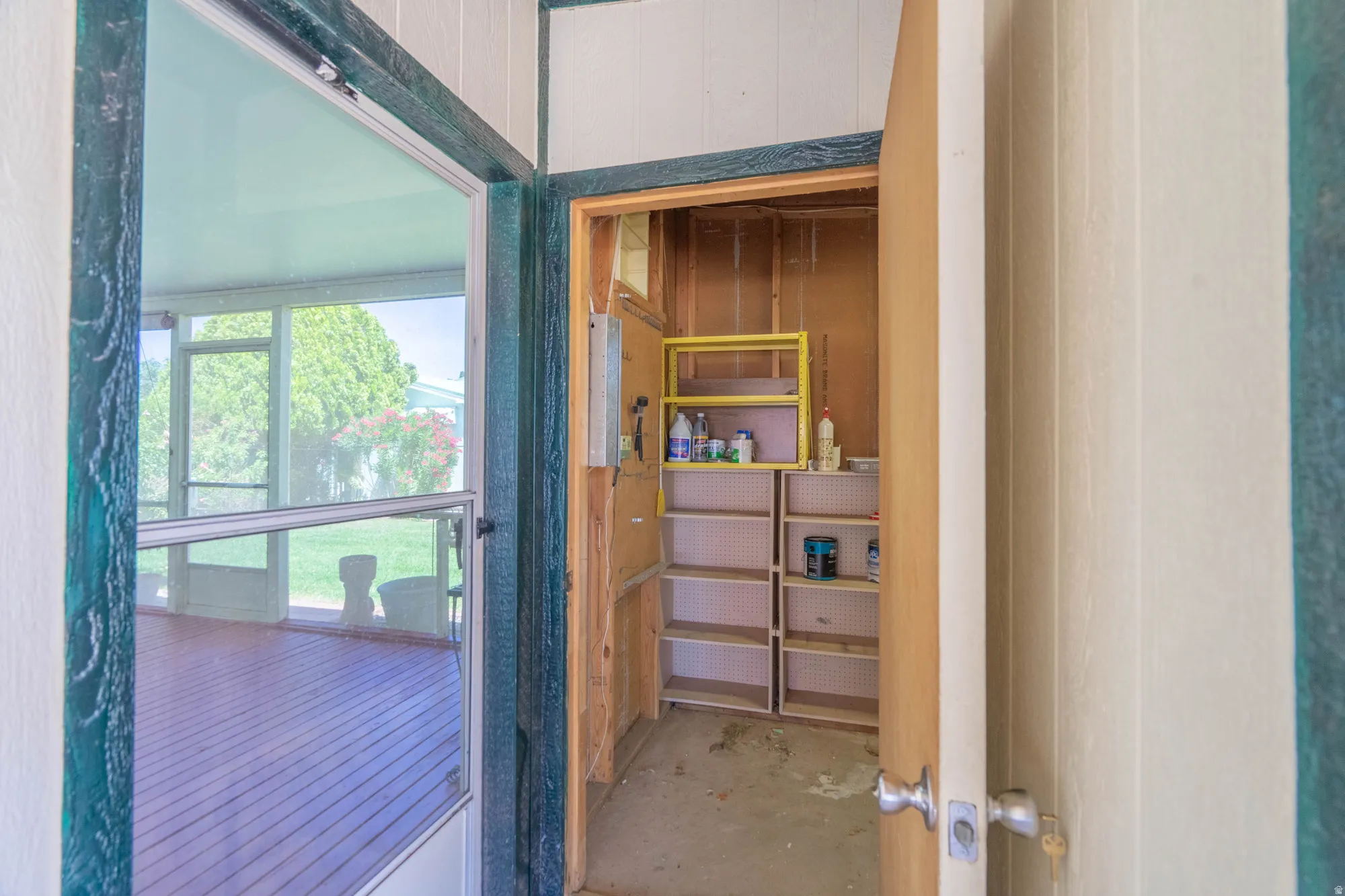 Screened porch with wood-finish flooring