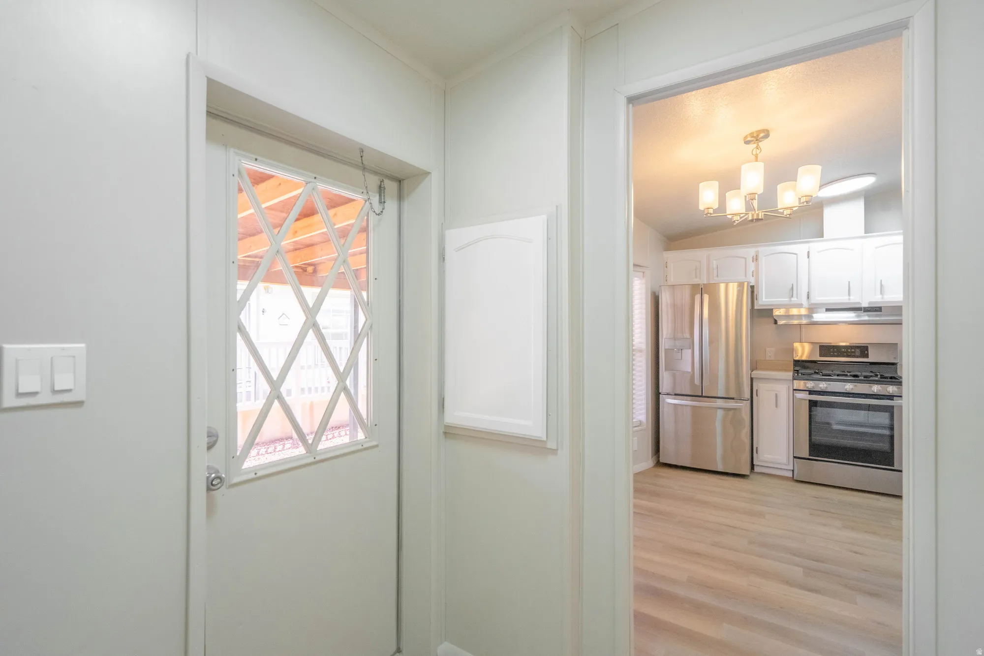 Bright white interior door with diamond-patterned window