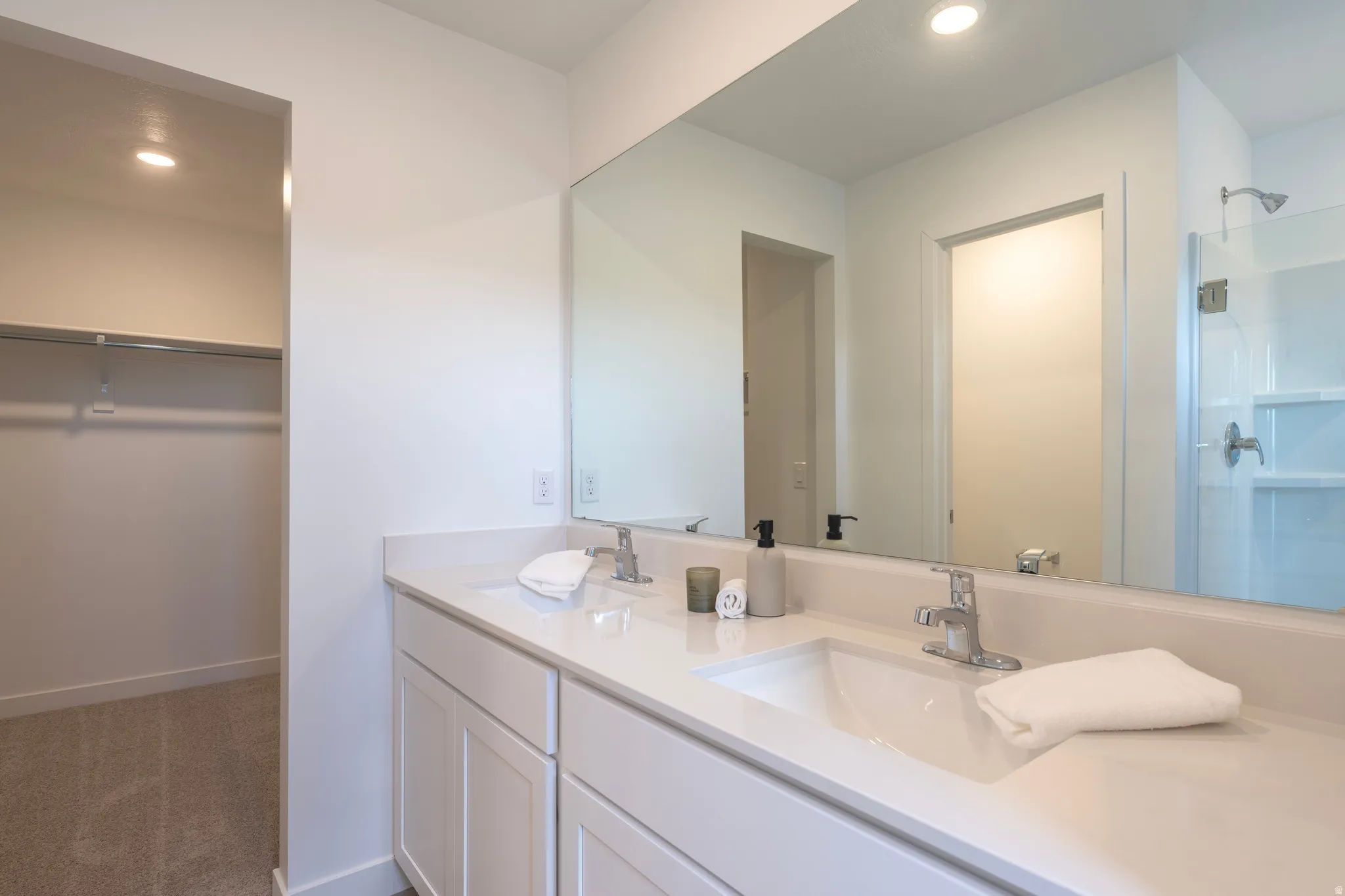 Dual vanity with integrated sinks and chrome fixtures