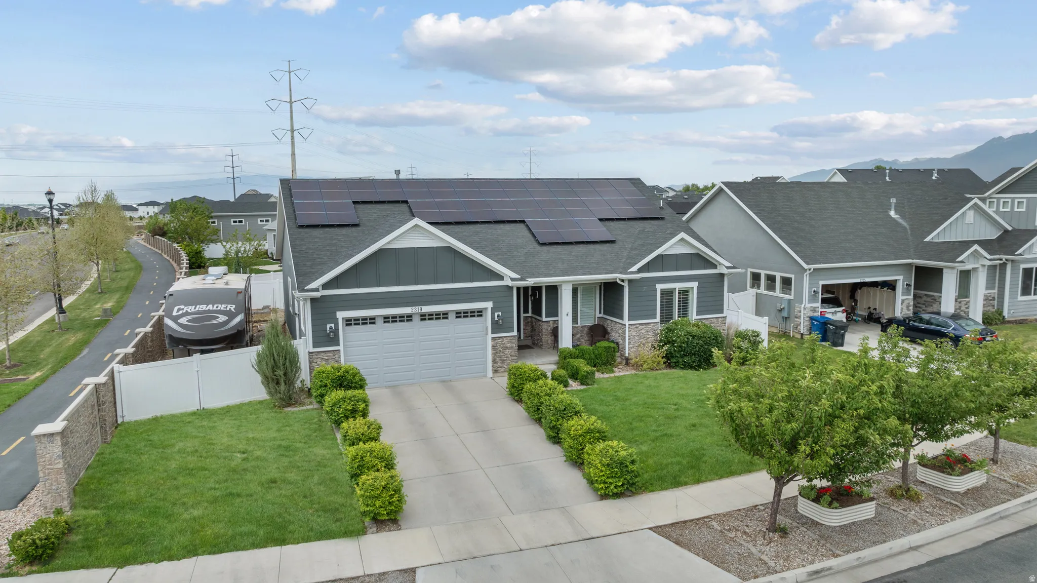 Note the RV parking on the side yard behind double gate