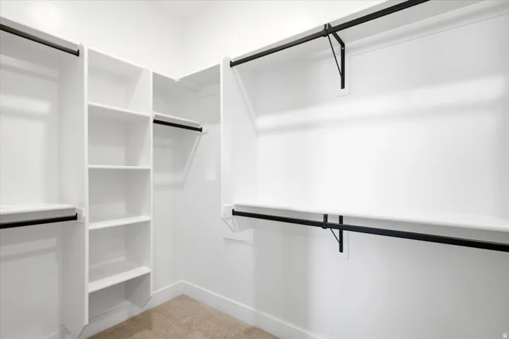 Primary bedroom walk-in closet