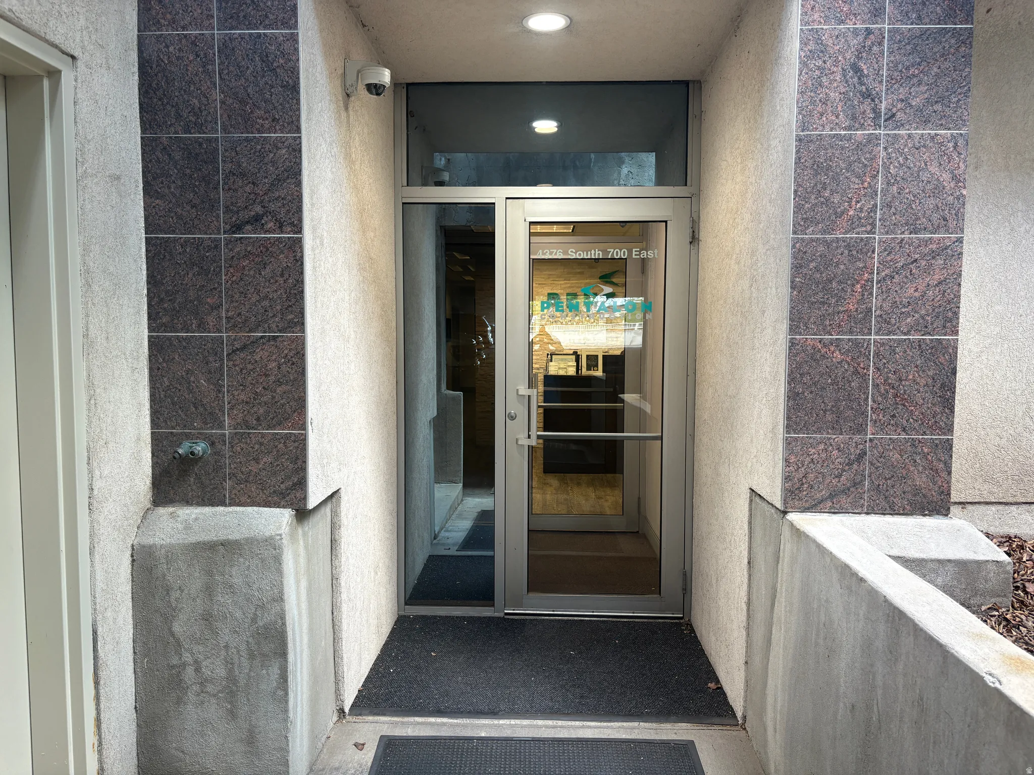 Glass entry door with aluminum framing