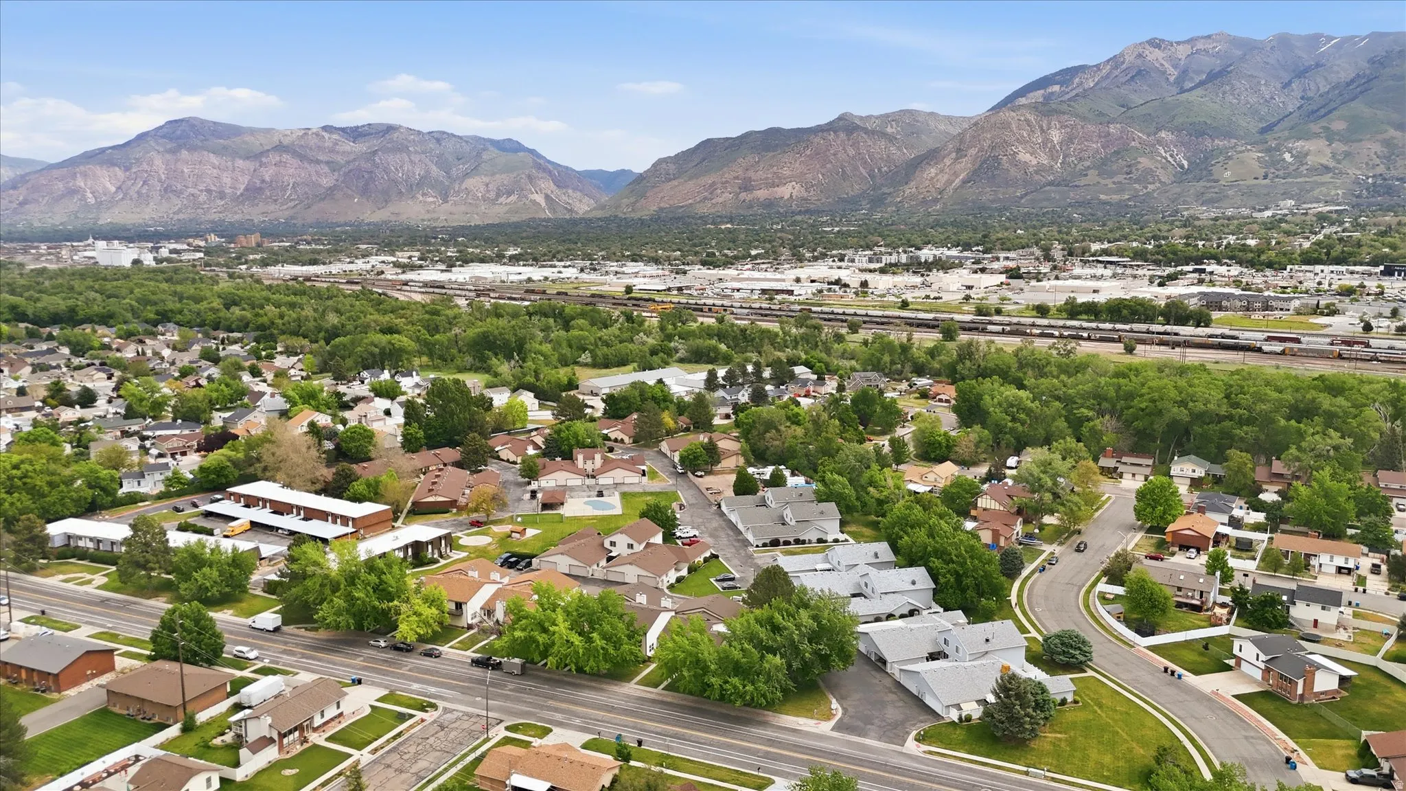 Expansive aerial showcasing a residential neighborhood with varied architectural styles