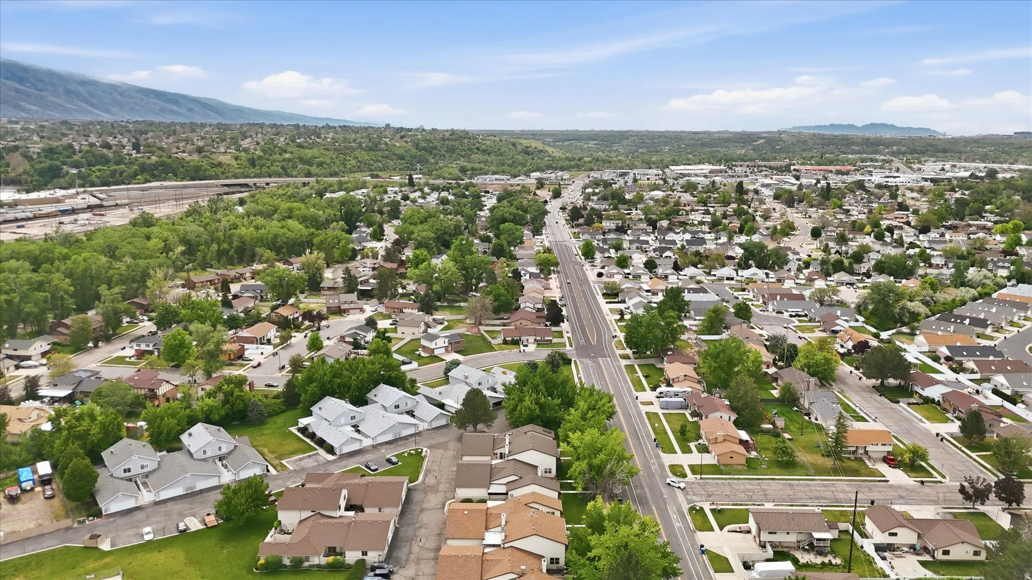 Expansive residential area with a prominent paved thoroughfare