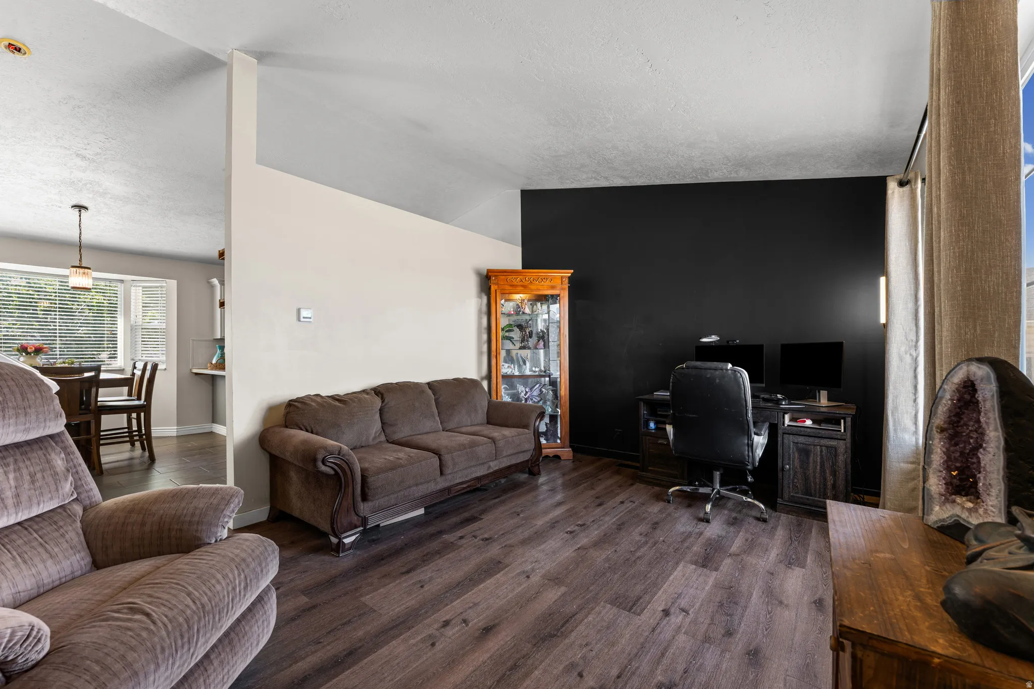 Hardwood-finish flooring extending into the dining area