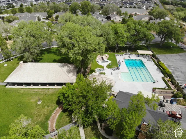 Outdoor swimming pool with integrated lap lanes, surrounded by a paved deck