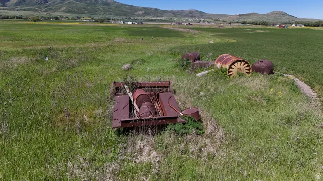 Expansive green landscape featuring varied terrain and distant mountains