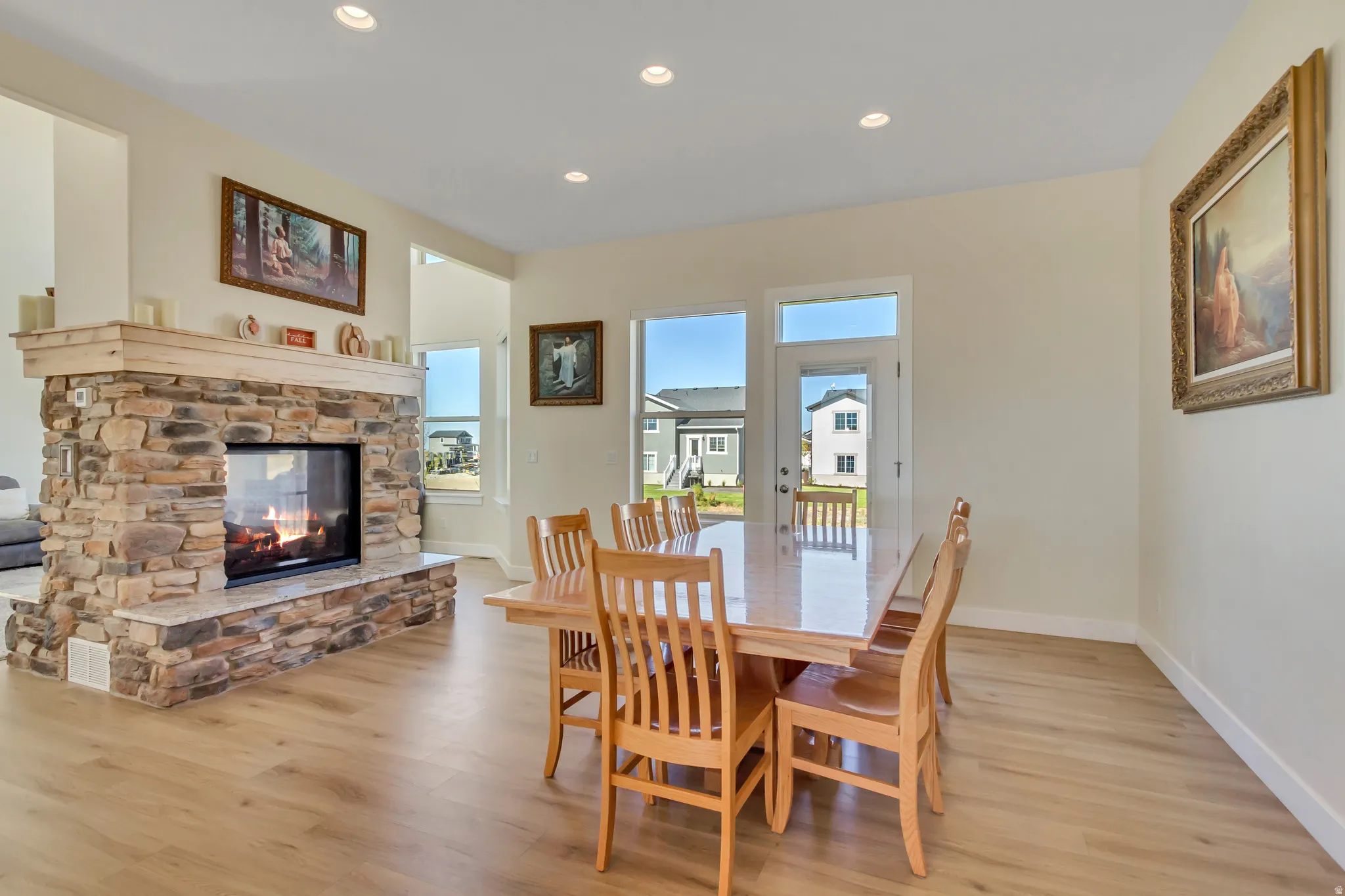 Stone-clad fireplace with a wood mantel