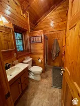 Interior space featuring extensive wood paneling on walls and vaulted ceilings