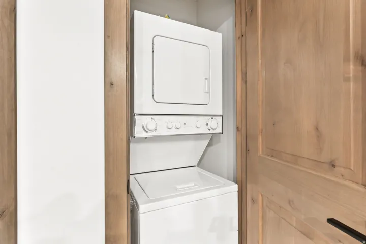 White stacked washer and dryer unit