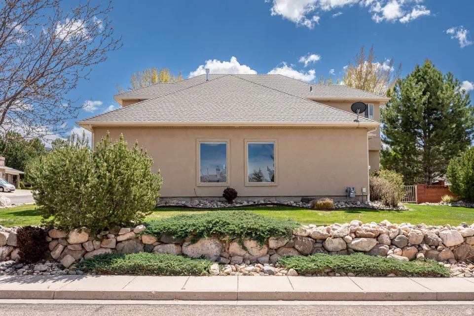 Stucco exterior with a pitched roofline