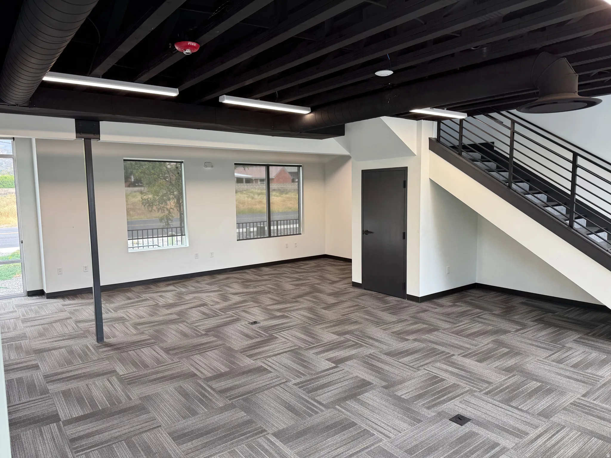 Expansive open-concept space featuring a patterned tile flooring
