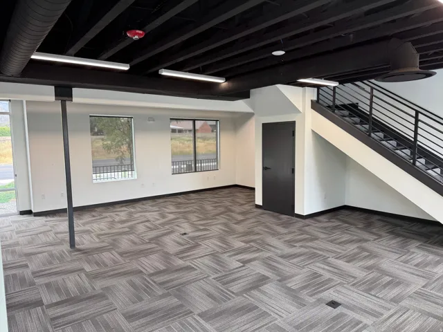 Expansive open-concept space featuring a patterned tile flooring