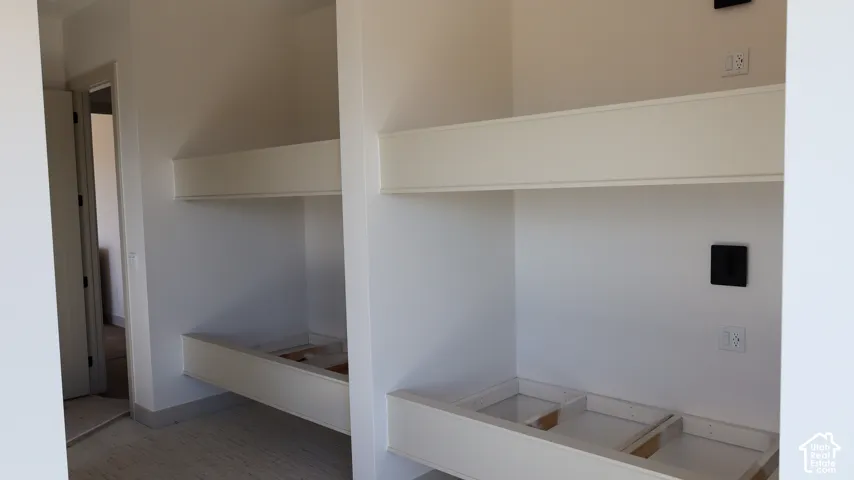 Built-in bunk bed structures with integrated wall outlets and light switches