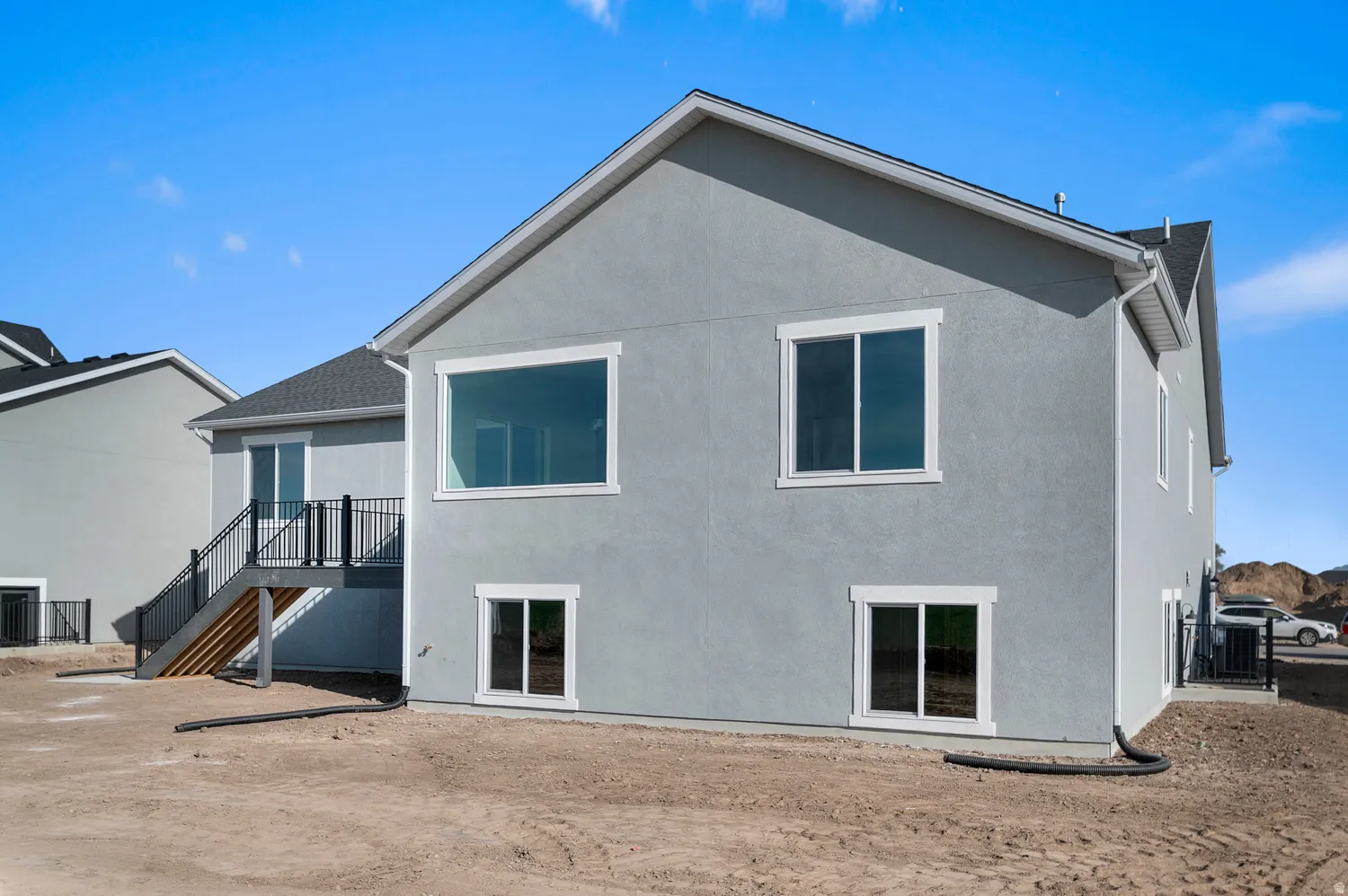 Contemporary stucco exterior with a multi-level design