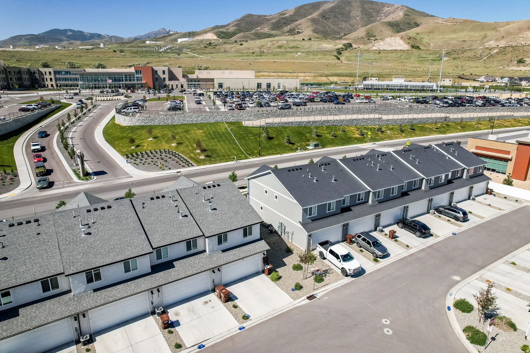 Modern townhome community featuring attached garages and private driveways