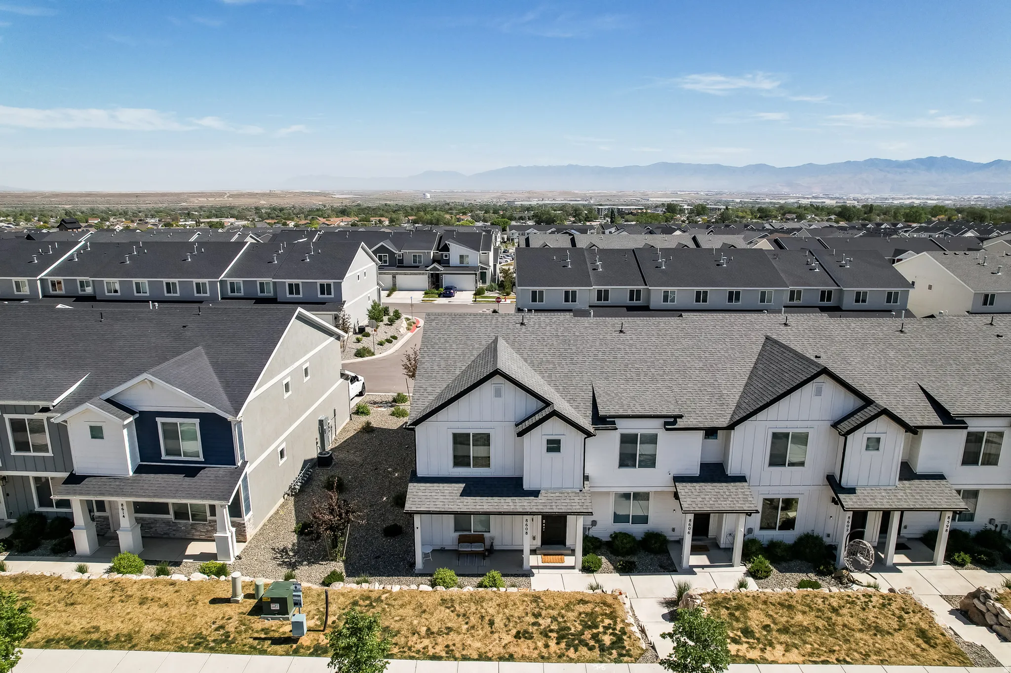 Aerial perspective showcasing a residential community with contemporary townhome-style residences