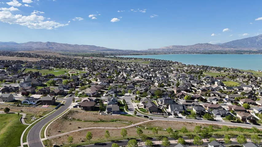 Expansive residential development featuring a lakefront setting and distant mountain ranges