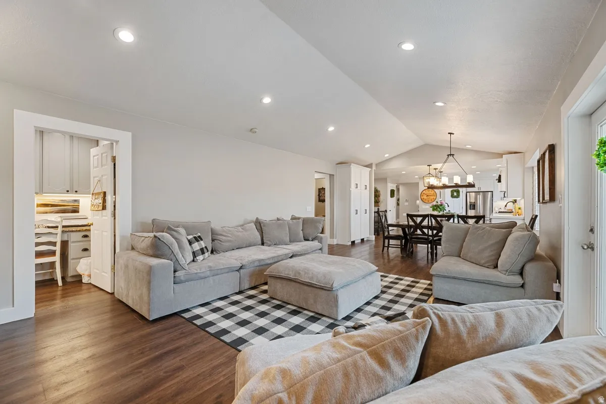 Open-concept living area with dark wood-finish flooring