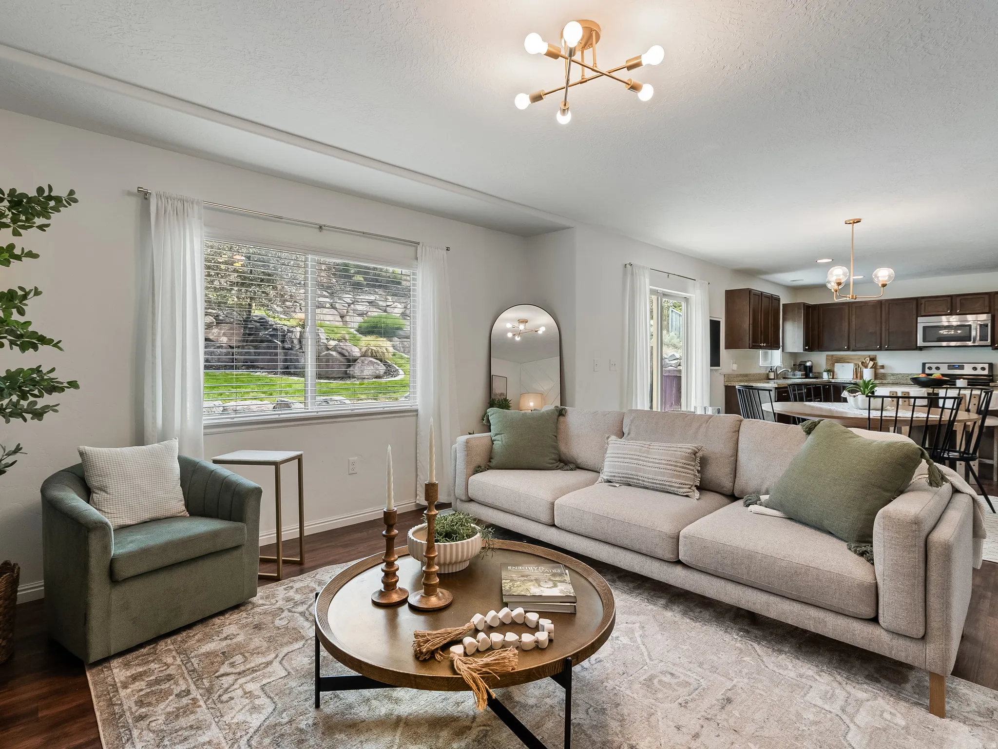 Open concept living space with wood-finish flooring