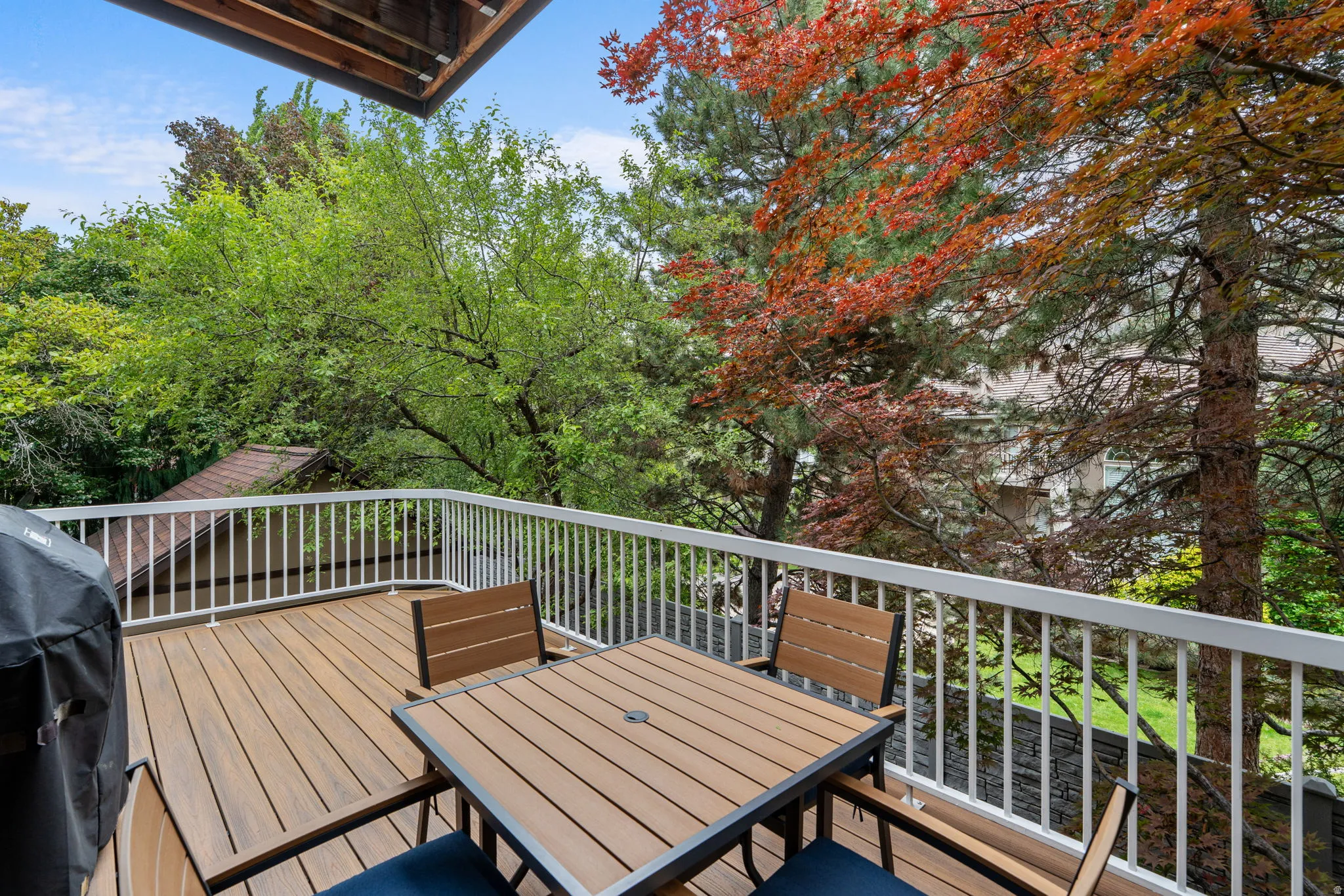 Spacious outdoor deck feature Trex flooring and accessed from family room