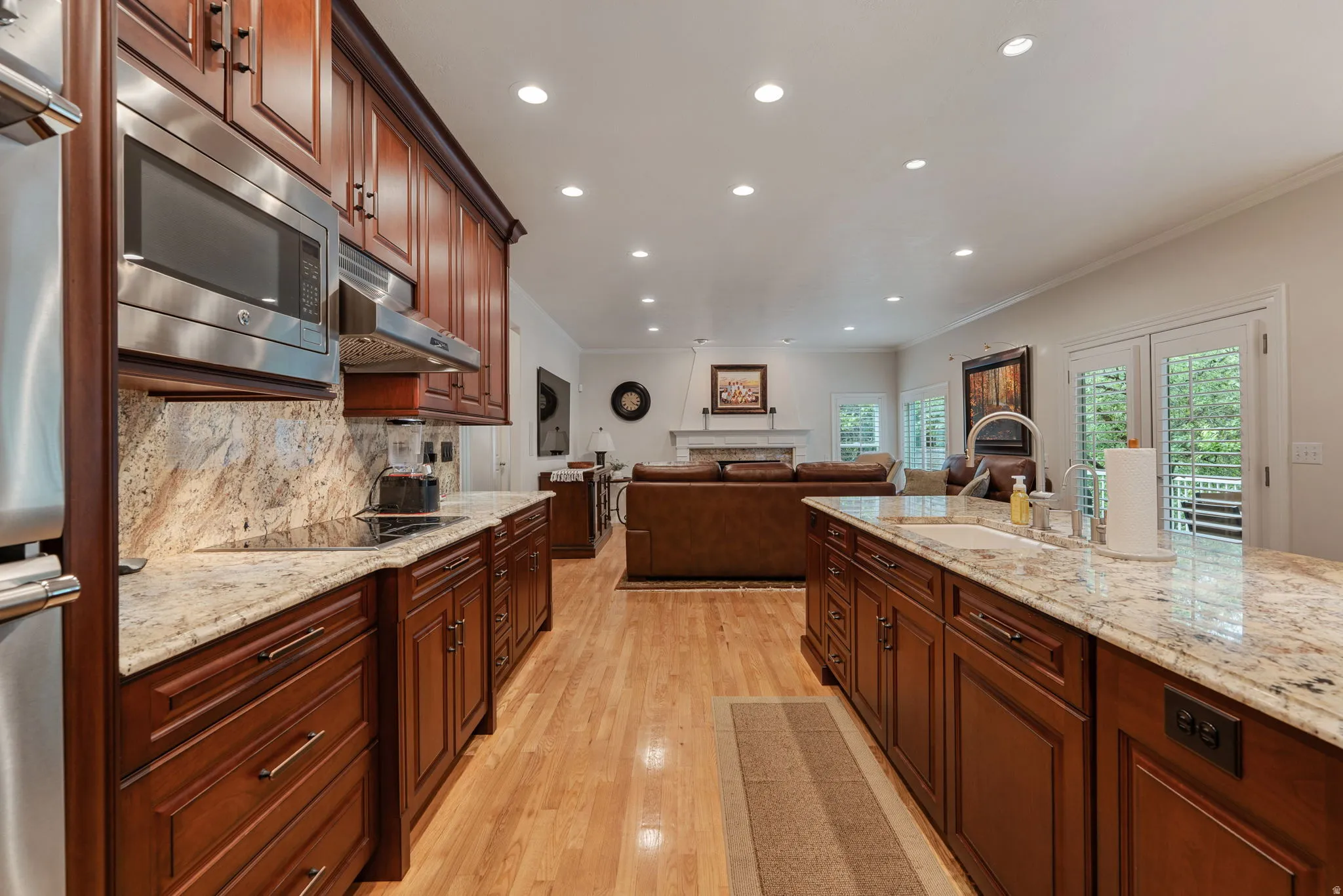 Gourmet kitchen with mahogany wood cabinetry, granite countertops, stainless steel appliances, Thermador double oven