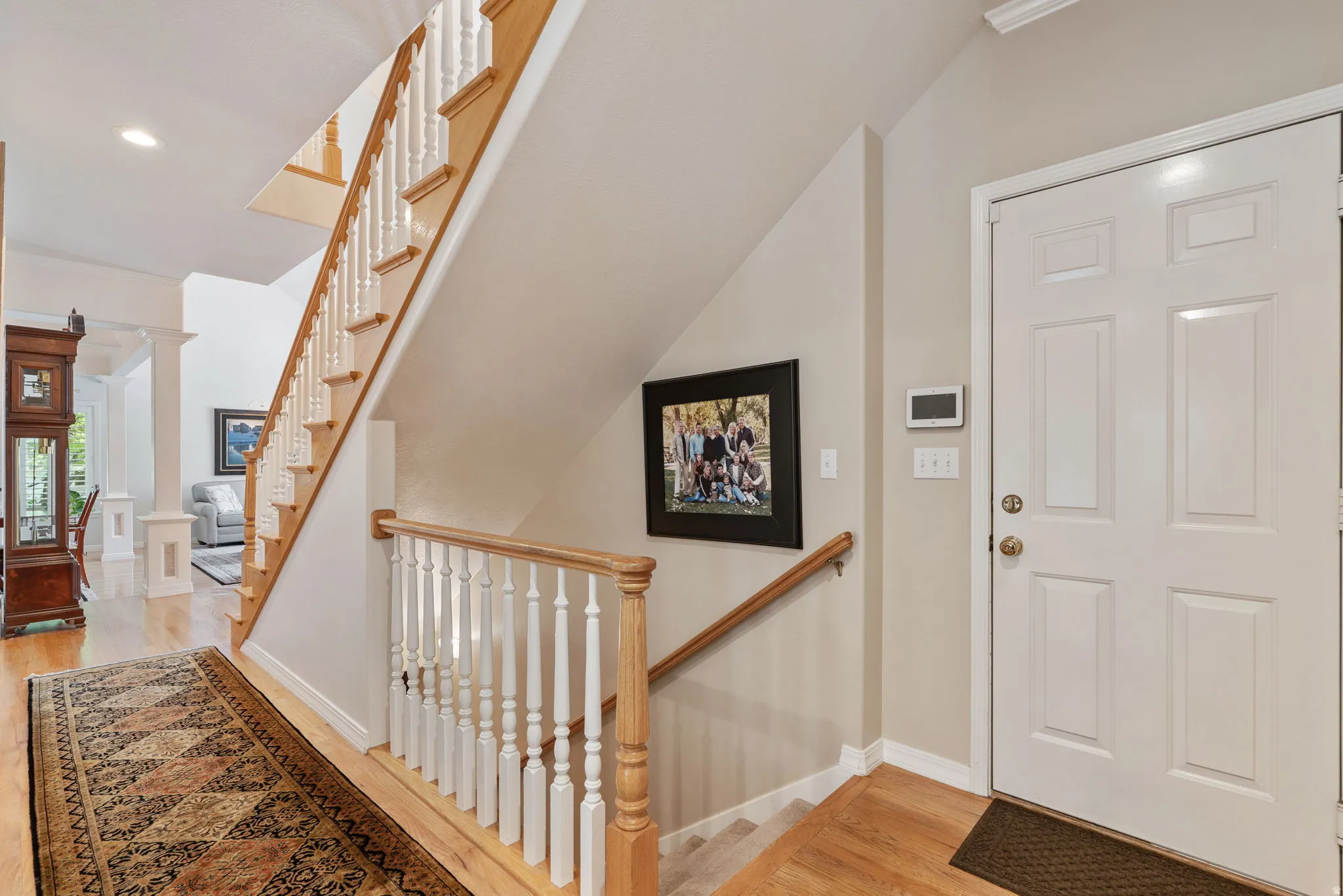 Hallway leading to basement and garage
