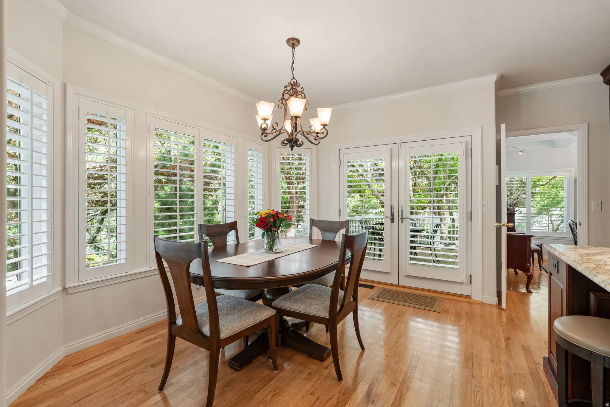 Breakfast area featuring hardwood flooring and a decorative chandelier