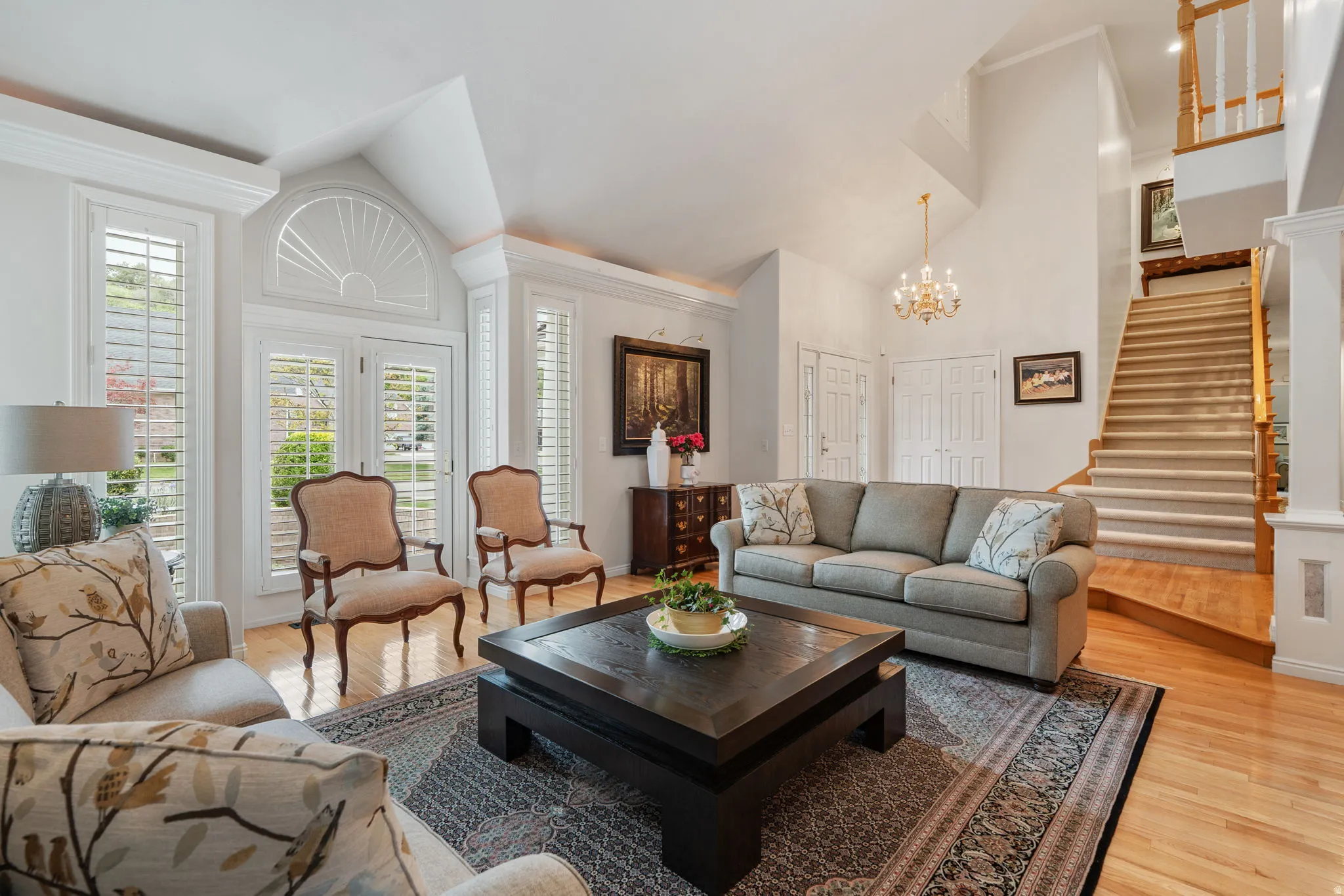 Formal living room with French doors and plantation shudders