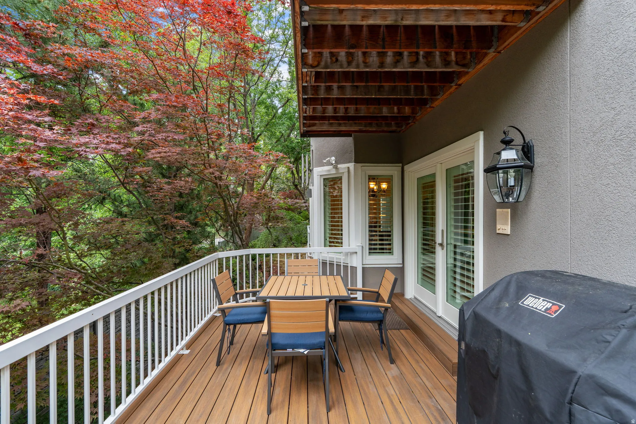 Accessed from family room outdoor deck featuring Trex flooring and a white railing system