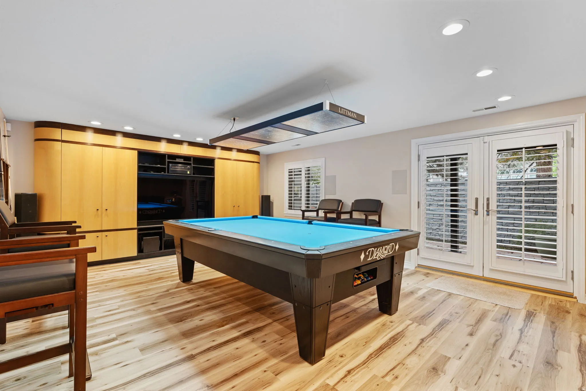 Recreation room with double French doors walks out to back patio