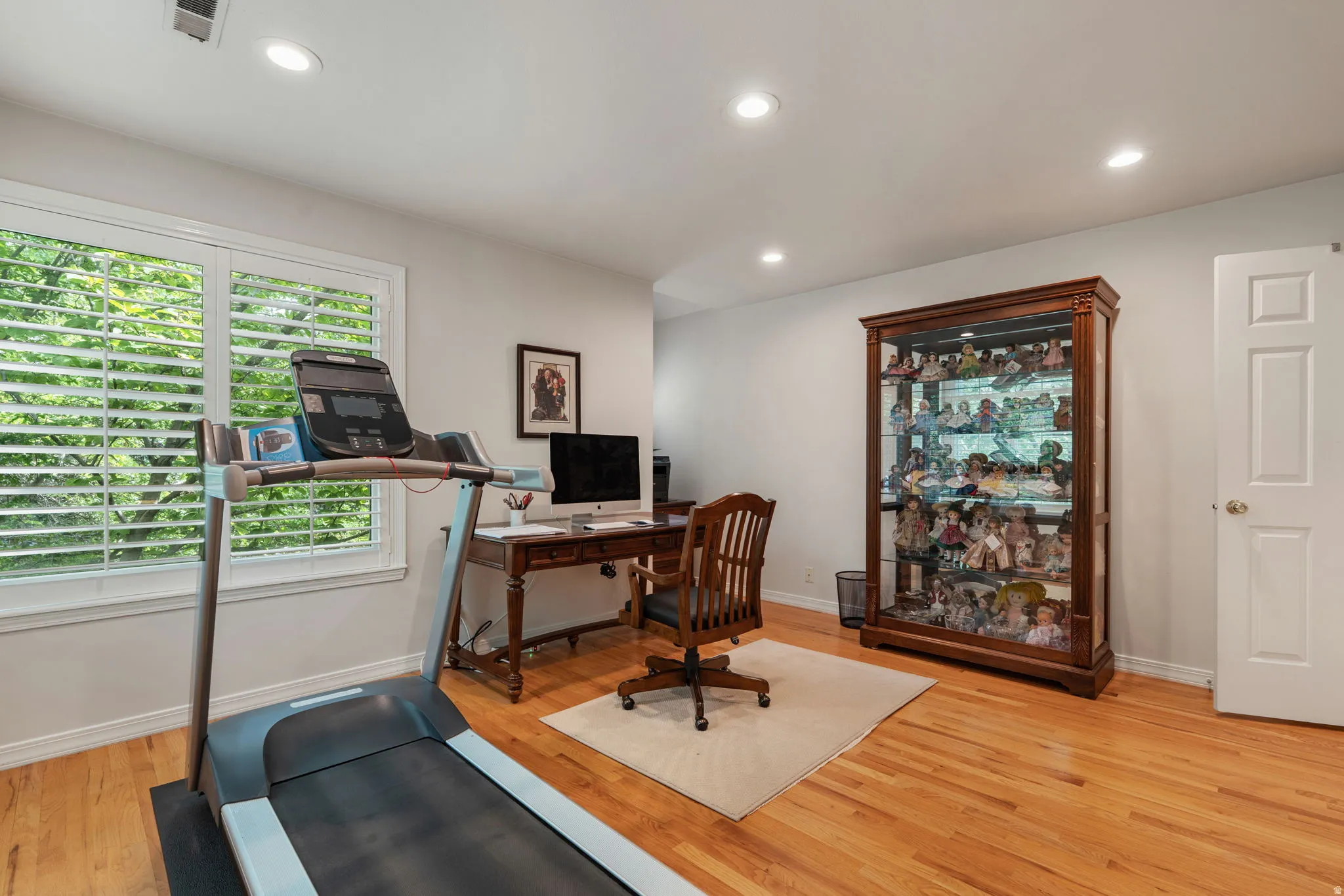 Bedroom with hardwood flooring and closet