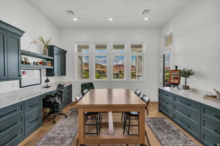 Art/Craft room featuring white walls and wood flooring