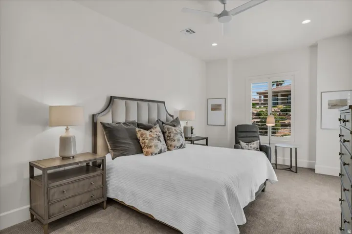 Spacious room featuring neutral carpeting and white walls