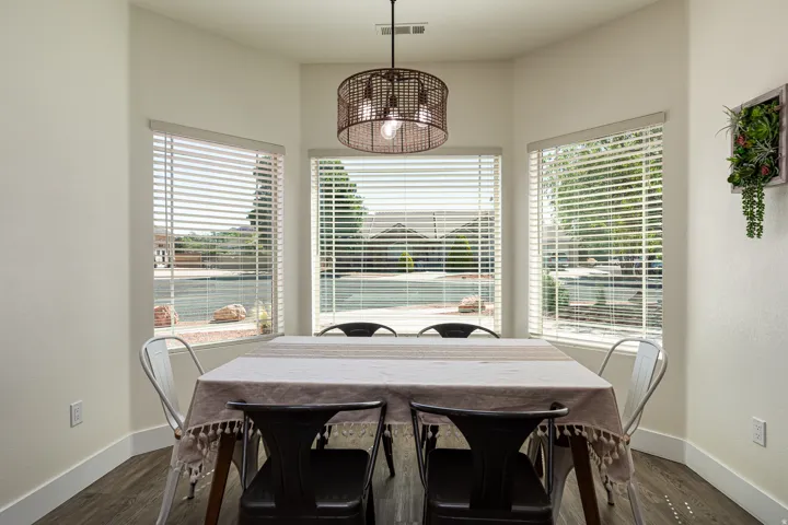 Bay window dining area with wood-finish flooring