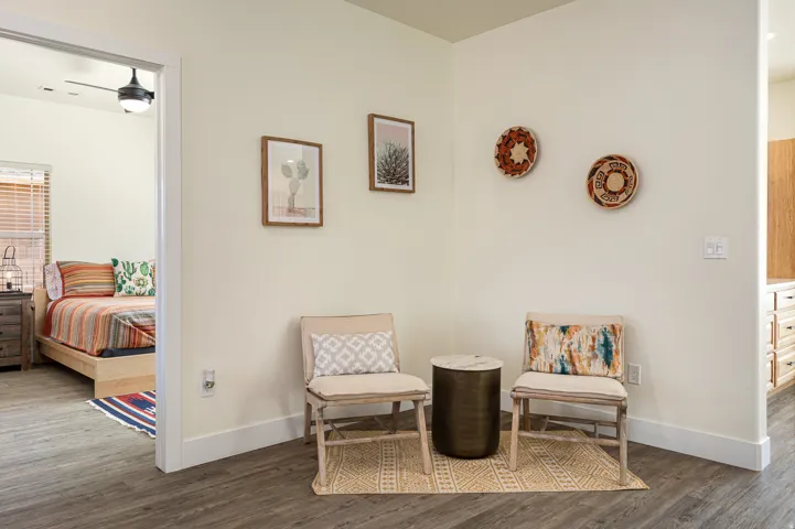 Neutral-toned walls complement wood-finish flooring throughout this interior space