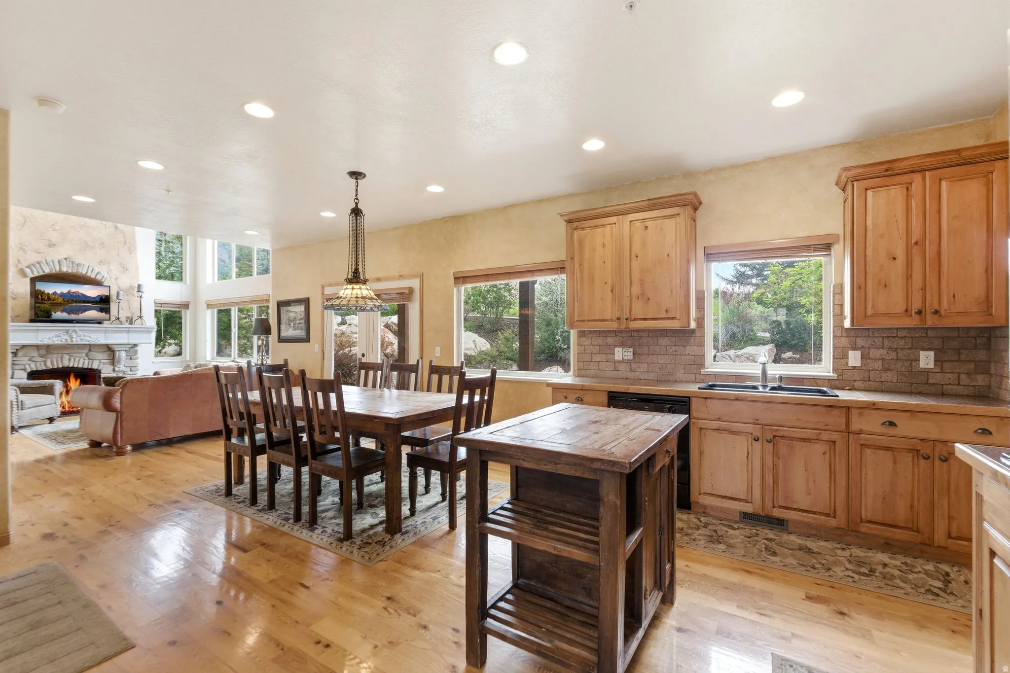 Open-concept living space with wood-finish flooring