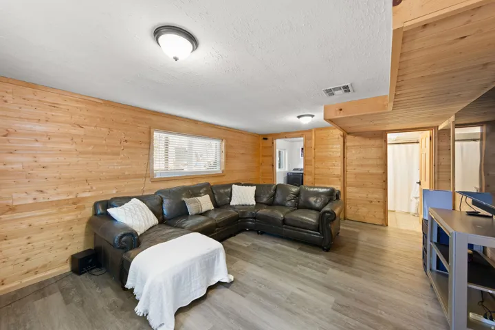 Wood-paneled walls and ceiling accents