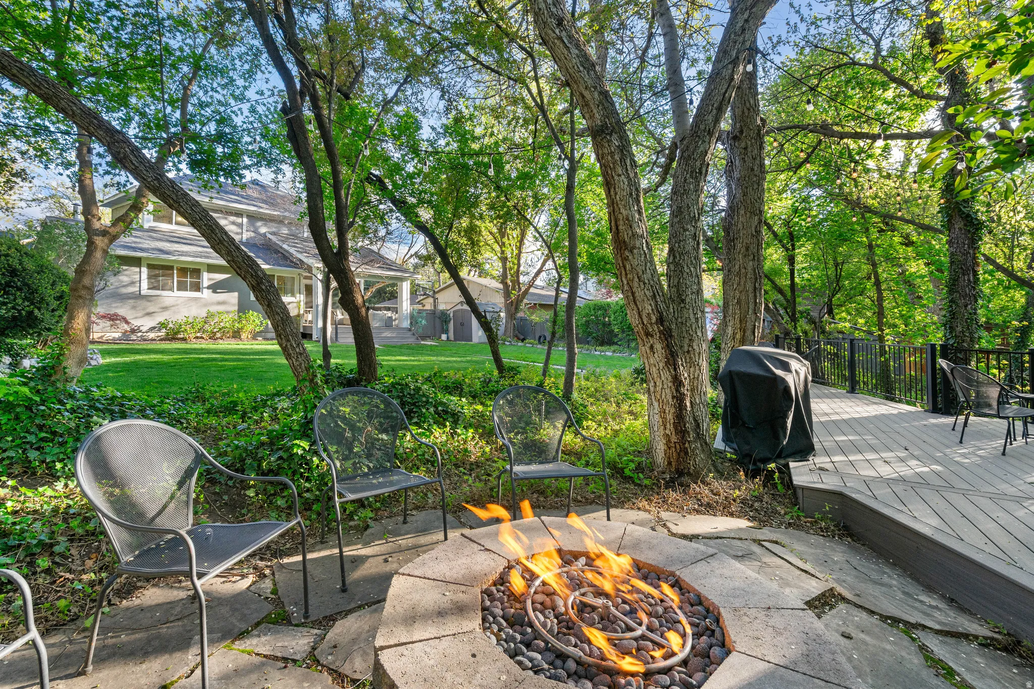 Stone fire pit with flagstone surround