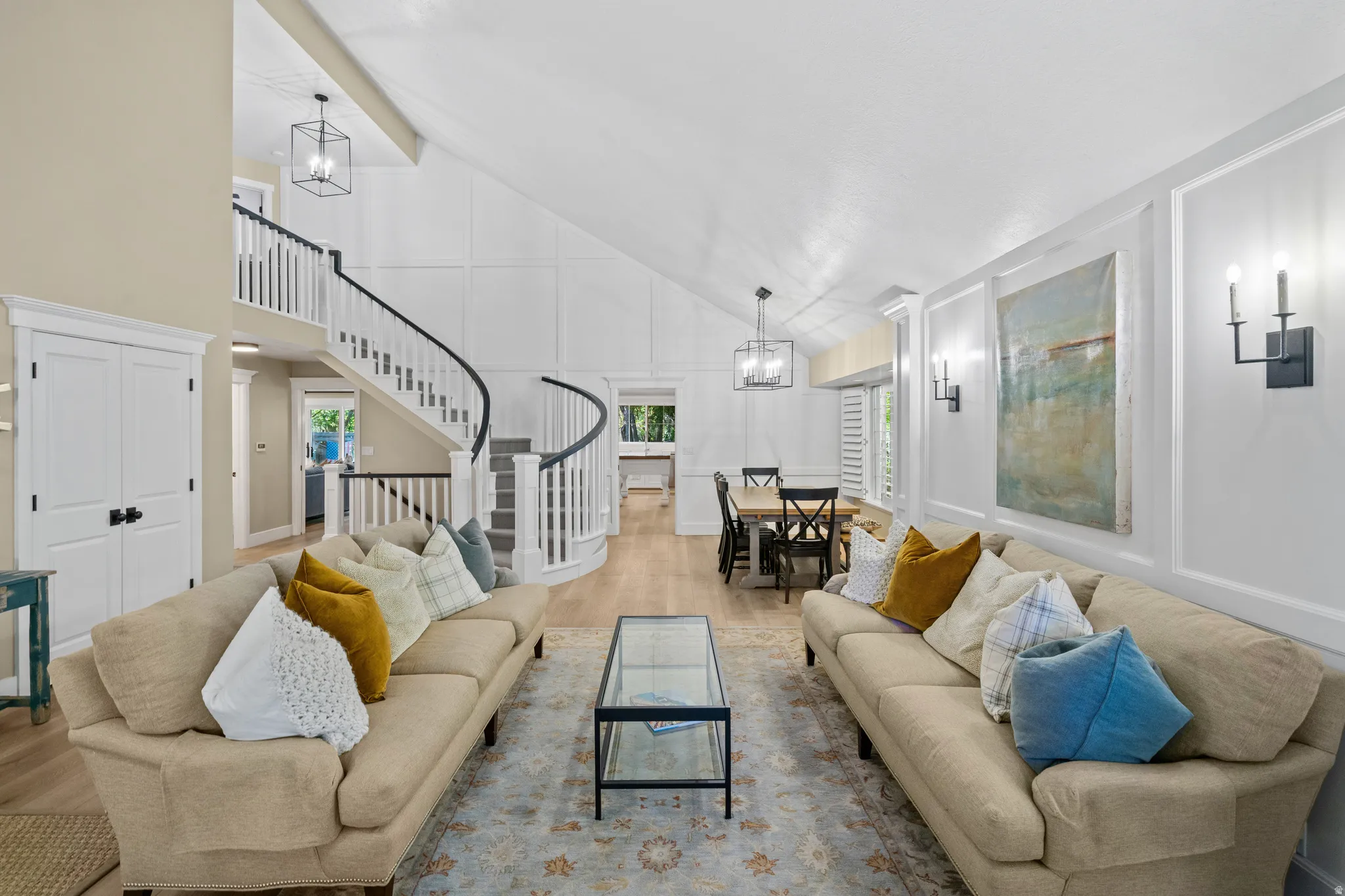 Vaulted ceilings with exposed beams complement the open-concept living space