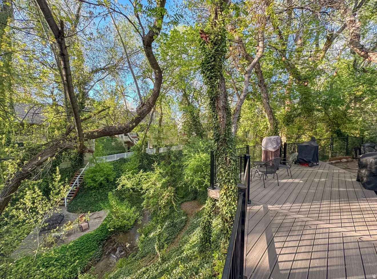 Elevated deck featuring composite decking and black metal railings