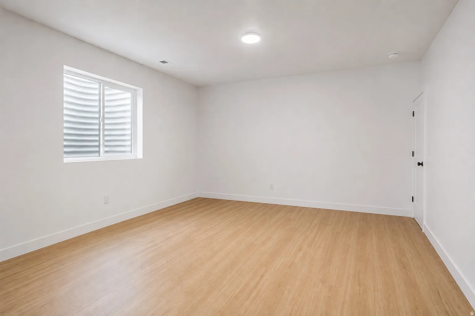 3rd bedroom: This spacious bedroom is located in the builder-finished basement with 9-foot ceilings, which includes a walk-in closet.