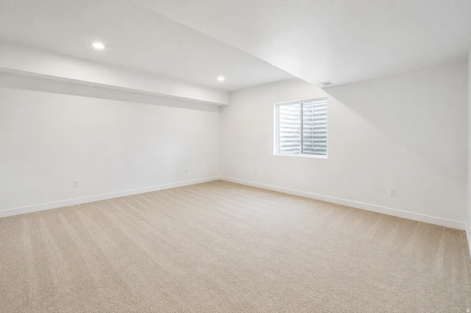 4th bedroom: This spacious bedroom is located in the builder-finished basement with 9-foot ceilings.
