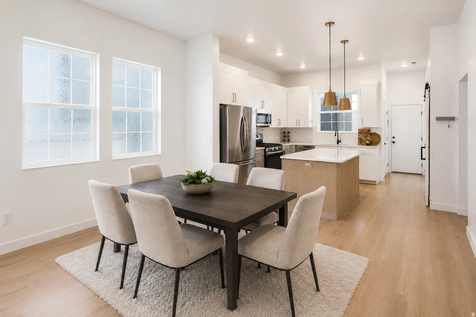 Open-concept living space professionally designed featuring with 10ft ceilings, quartz counter tops throughout, and lots of windows for so much natural light! Sink-free island