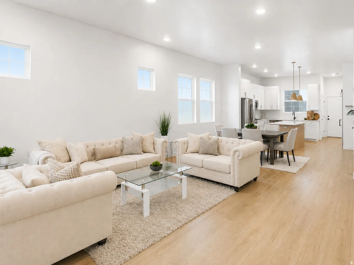 Open-concept living space professionally designed featuring with 10ft ceilings, quartz counter tops throughout, and lots of windows for so much natural light! Sink-free island